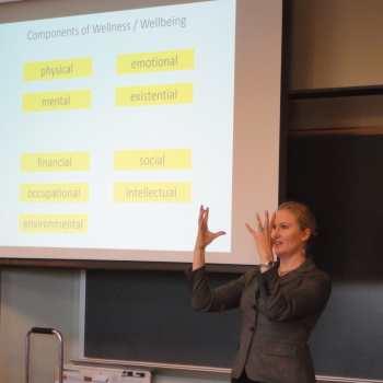 Katherine Sauer gesturing during a presentation